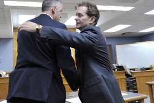 COURT POOL PHOTO Brian Hyde, left, hugs his attorney Drew Segadelli after Judge Mary Orfanello found Hyde not guilty.