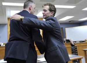 COURT POOL PHOTOBrian Hyde, left, hugs his attorney Drew Segadelli after Judge Mary Orfanello found Hyde not guilty.