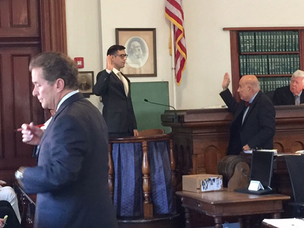 Adam M Smith of Berkley, Calif., raises his hand to be sworn in to testify during his trial in Edgartown. - Rich Saltzberg